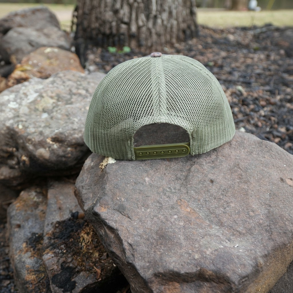 Green mesh trucker cap with leather patch, DIY Hunter camouflage design, adjustable back, casual outdoor style.