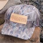 DIY Hunter camo trucker cap with solid camo pattern, featuring a five-panel design and adjustable back strap.