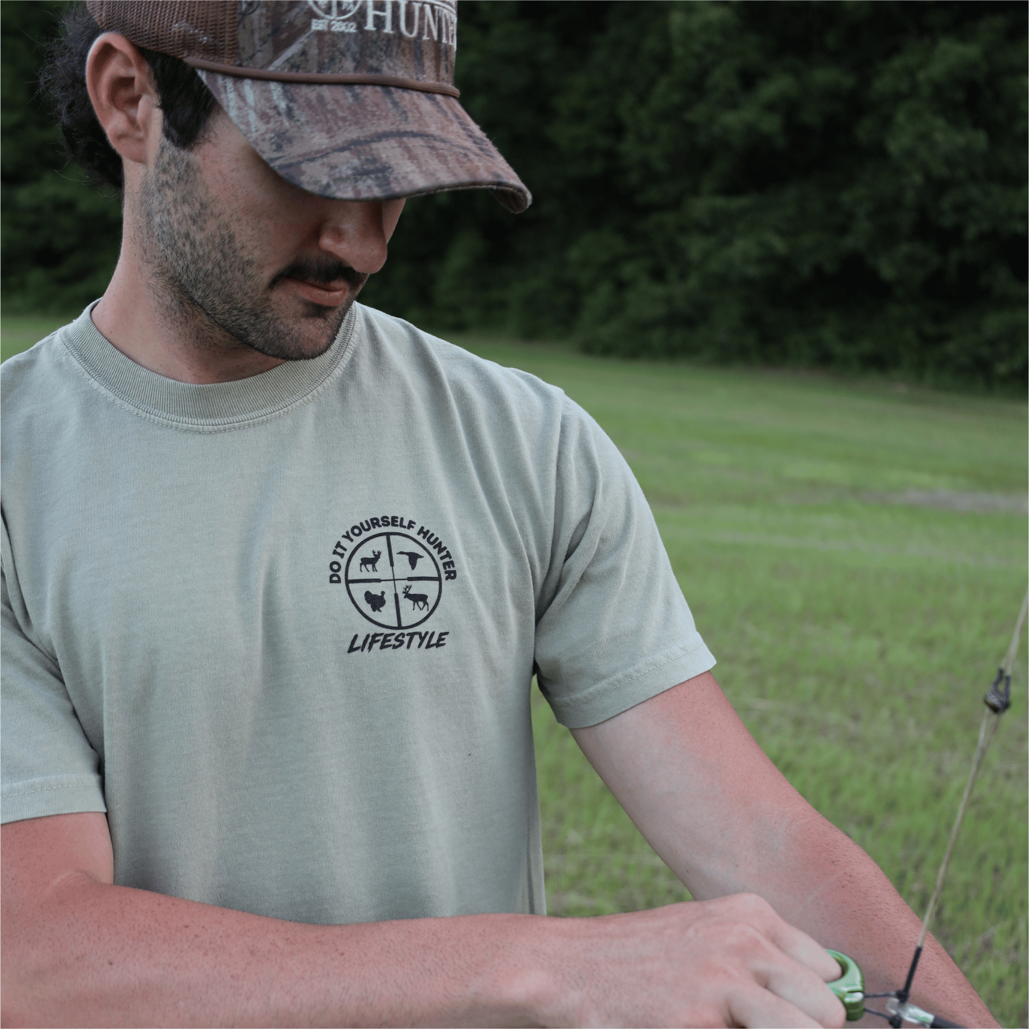 Black 250th House Buck T-shirt from the Do It Yourself Hunter lifestyle collection featuring a detailed buck graphic on the front.