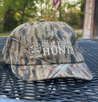 DIY Hunter camo cap for archery, featuring a camouflage pattern and adjustable brim, ideal for hunting and outdoor activities.