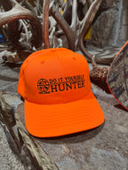 Do It Yourself Hunter blaze orange cap with adjustable strap, designed for outdoor hunting safety and visibility.