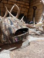 DO IT YOURSELF HUNTER camo cap designed for archery, featuring a camouflage pattern and adjustable strap for outdoor hunting activities.