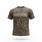 Hunter Camo cotton T-shirt by DO IT YOURSELF HUNTER on a ghost mannequin, featuring a logo design on the front.